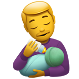 man feeding baby