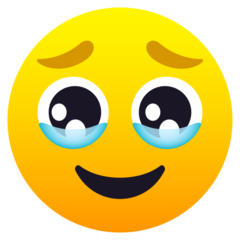 How emoji face holding back tears displayed on Joypixels