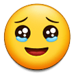 How emoji face holding back tears displayed on Samsung